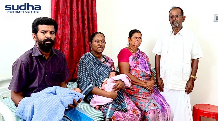 Happy Couple with their family holding twin babies at Sudha Fertility Centre Chennai - Available at Tamil Nadu, Karnataka, Andhra Pradesh, Pondicherry, and Telangana